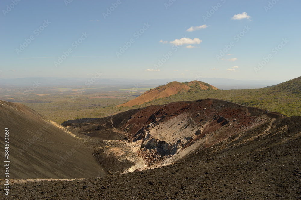 Hiking and snowboarding in the volcanic ashes on the Nicaraguan Volcanoes outside of Léon, Central America