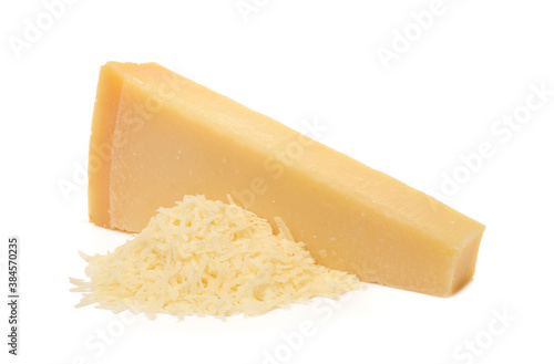 Whole and grated italian hard cheese Grana Padano or Parmesan isolated on white background. Delicious ingredient for pizza, sandwiches, salads.