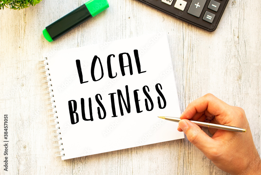 A hand with a pen writes in a notebook. View from above. Business concept.