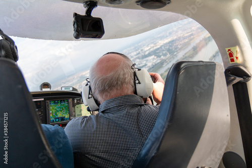 passenger in small aircraft with headset