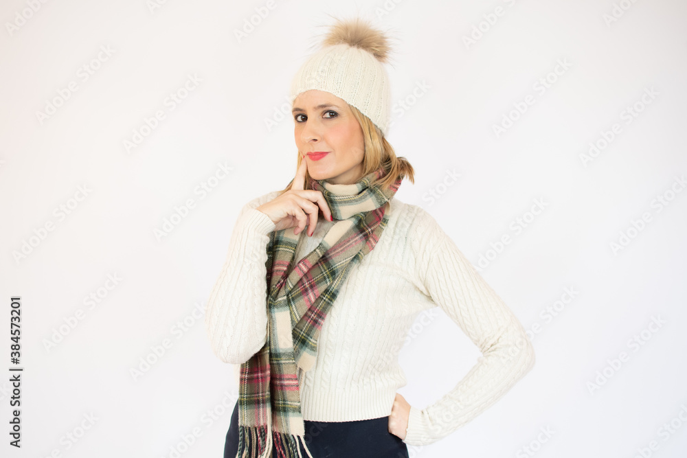 Happy Young Beautiful Woman in winter clothes on white background with copy space. Sales and discount concept Happy Young Beautiful Woman in winter clothes on white background with copy space. Sales and discount concept