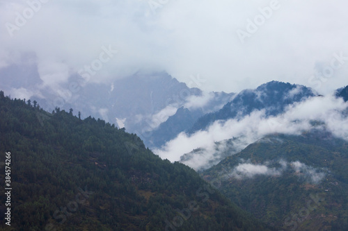 Forested mountains in cloud and mist © saiko3p