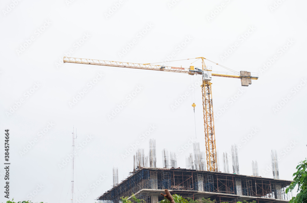 Construction site with a crane within the city Construction site with a crane within the city