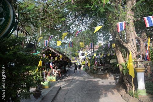 Street view of Tonsai bay pier with restaurants and bars in Phi Phi island,  Krabi province, Thailand photo