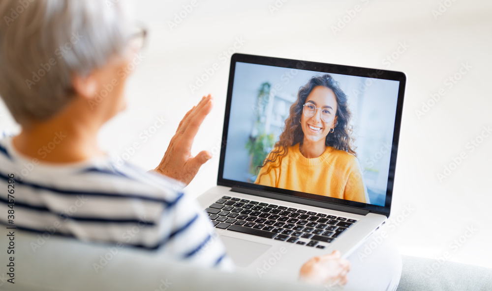 Senior woman is using laptop for conversation with daughter Senior woman is using laptop for conversation with daughter