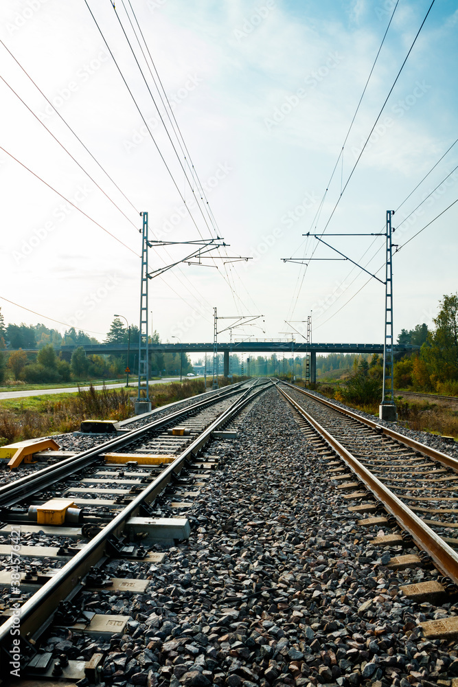 Two lane railroad with electric power lines