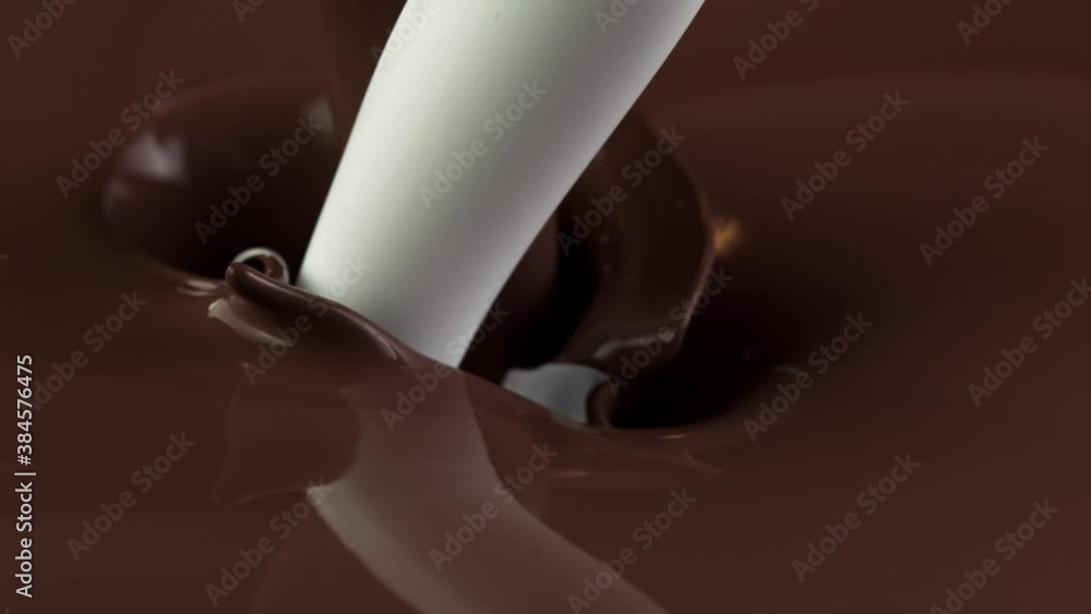 Super slow motion of pouring hot chocolate and milk splashes in detail. Filmed on high speed cinema camera, 1000fps.