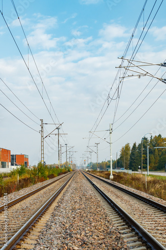 Two lane railroad with electric power lines