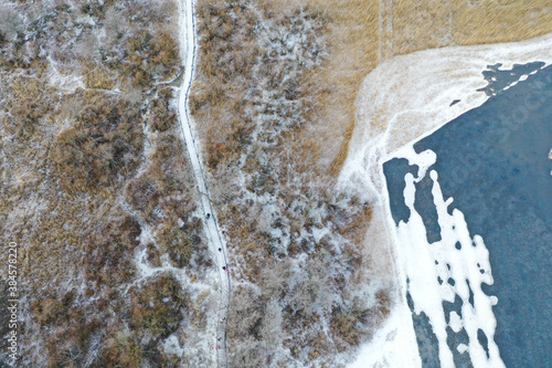 Aerial views of frozen nature in Lammassaari, Helsinki, Finland photo