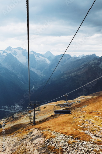 hill view. grassy mountainside. rise in height. ropeway. cable car.