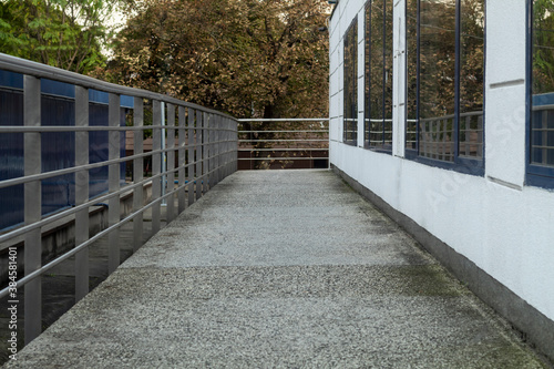 Walkway with handrails and wall with windows