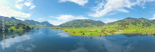 Wide panorama of Lake Lauerz. Switzerland. Aerial view.