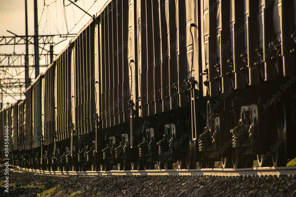 Obraz premium Transportation of industrial and civil goods by rail. Various types of wagons. Perspective photographs.