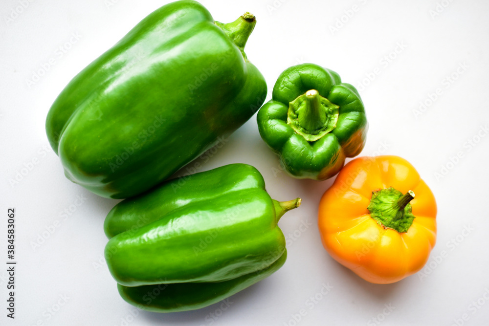 Yellow green regular pepper on a white background Yellow green regular pepper on a white background
