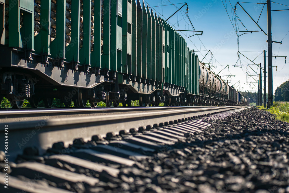 Obraz premium Transportation of industrial and civil goods by rail. Various types of wagons. Perspective photographs.
