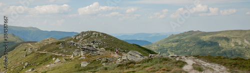 Panorama of Carpathians mountain range at summer morning. Beauty of wild virgin Ukrainian nature. Peacefulness.