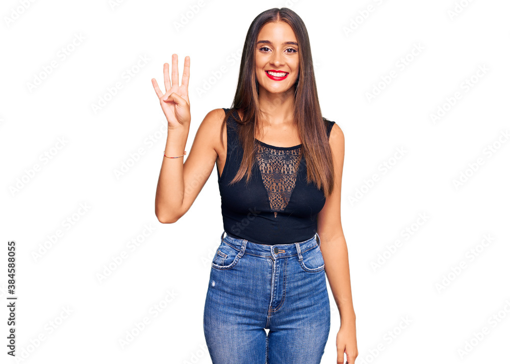 Young hispanic woman wearing casual clothes showing and pointing up with fingers number four while smiling confident and happy. Young hispanic woman wearing casual clothes showing and pointing up with fingers number four while smiling confident and happy.