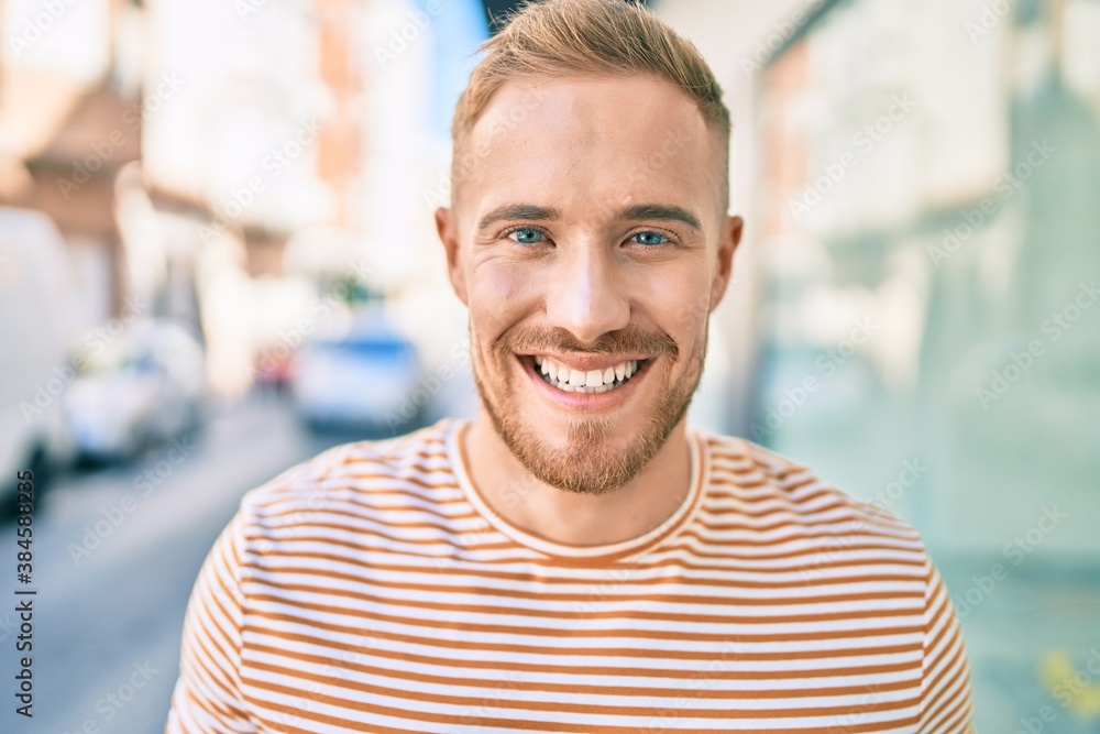 Young irish man smiling happy walking at street of city. Young irish man smiling happy walking at street of city.