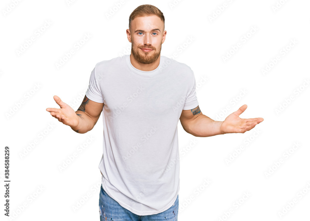 Young irish man wearing casual clothes clueless and confused expression with arms and hands raised. doubt concept. Young irish man wearing casual clothes clueless and confused expression with arms and hands raised. doubt concept.