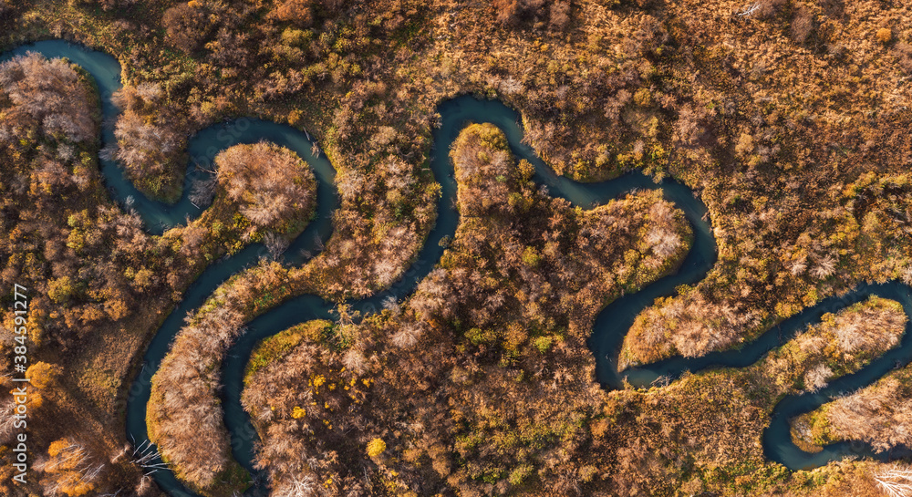 Aerial drone view of autumn landscape with river.