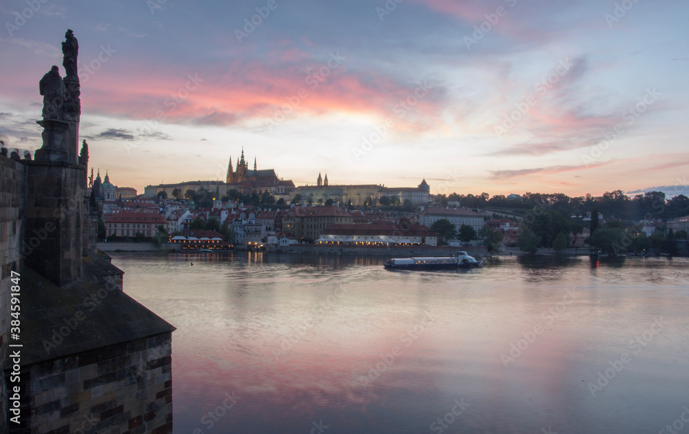 Prague charles bridge sunset view with castle in backgorund