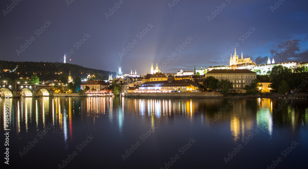 Pargue charles bridge and prague castle by night reflections river