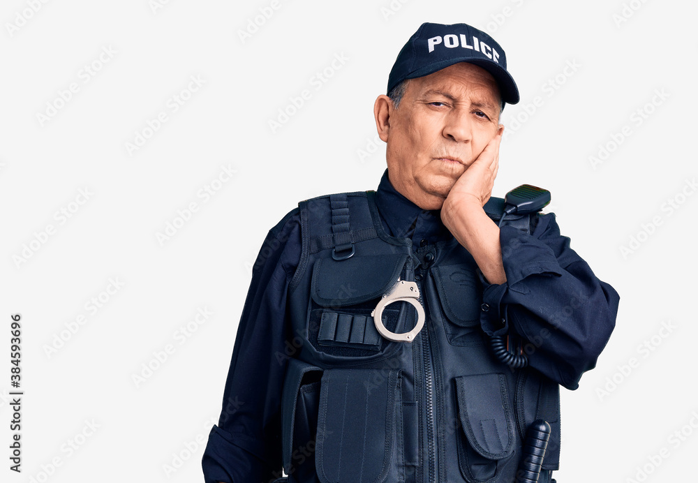 Senior handsome man wearing police uniform thinking looking tired and bored with depression problems with crossed arms. Senior handsome man wearing police uniform thinking looking tired and bored with depression problems with crossed arms.