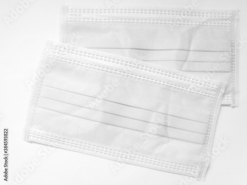White surgical face mask on white background, Health care concept and can protect virus covid-19, medical masks, fabric mask protect air pollution