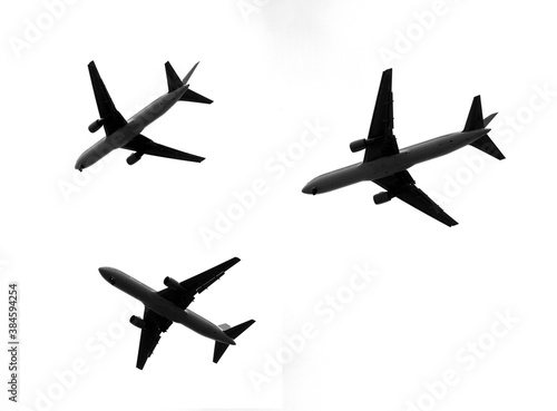 black and white photography, silhouettes of Boing 767 in different positions 