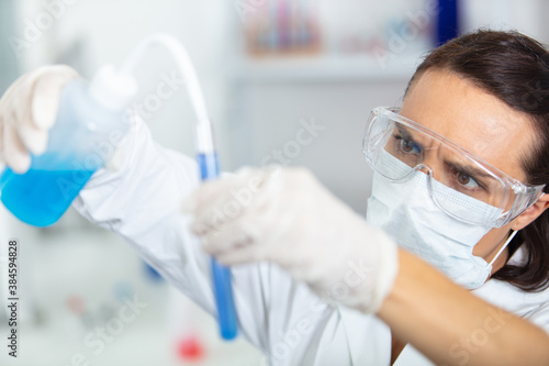 portrait of a smiling chemist in the laboratory