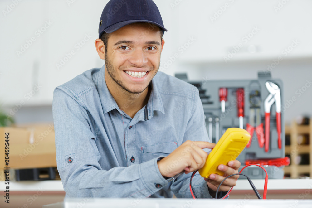 a happpy electrician at work a happpy electrician at work