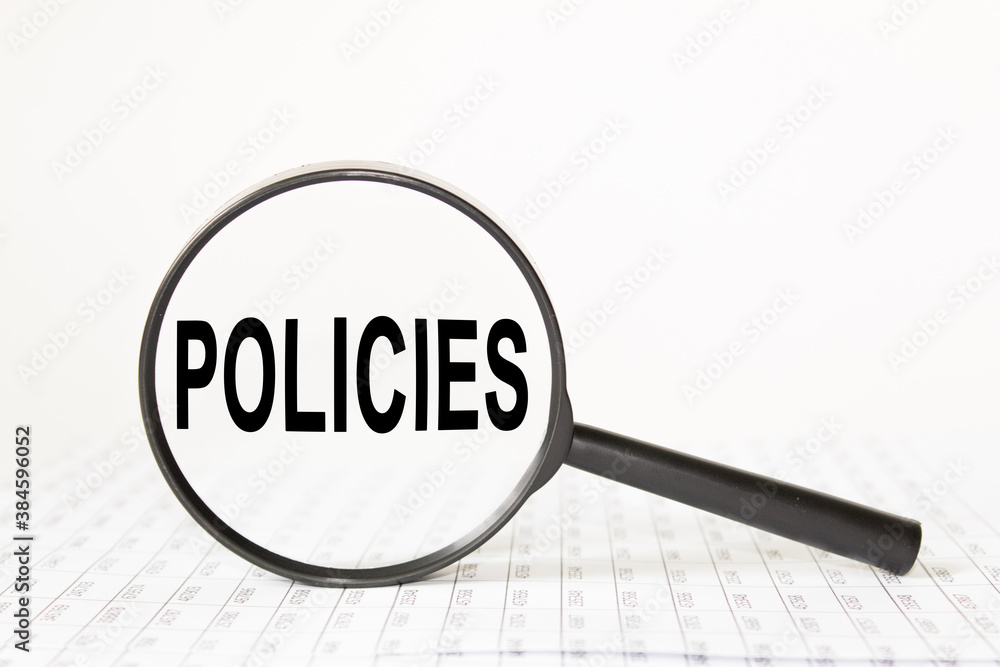 words POLICIES in a magnifying glass on a white background. business concept words POLICIES in a magnifying glass on a white background. business concept