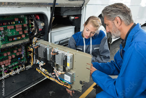 mechanics checking the problem of the campervan