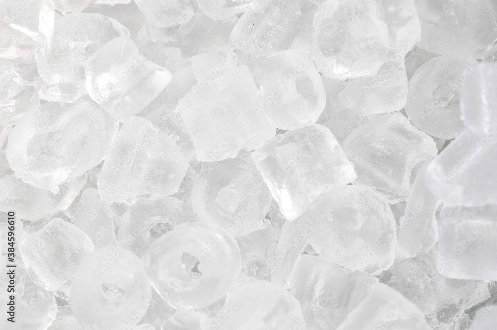 Obraz premium Ice background on the ice bucket. Ice is very cold. Cubes for drinking or cooking.