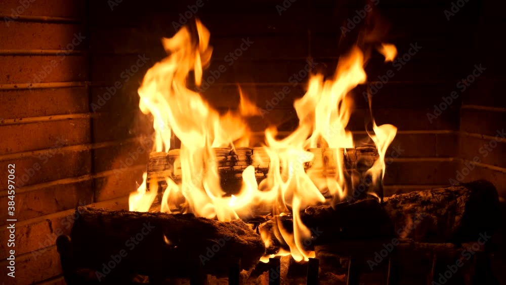 Christmas time. Wood burning in a cozy fireplace at home 4k footage Christmas time. Wood burning in a cozy fireplace at home 4k footage