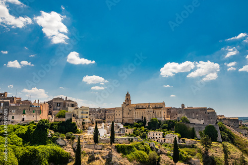 Gravina in Puglia, Italy. the skyline of the city with its houses and palaces and the cathedral, seen from the archaeological park of Botromagno on top of the opposite hill.