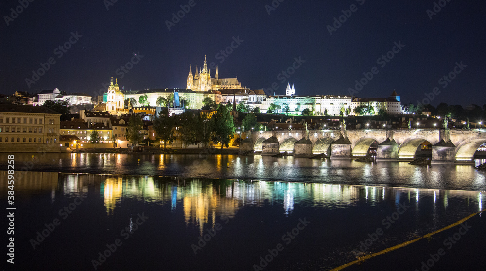 Pargue charles bridge and prague castle by night reflections river