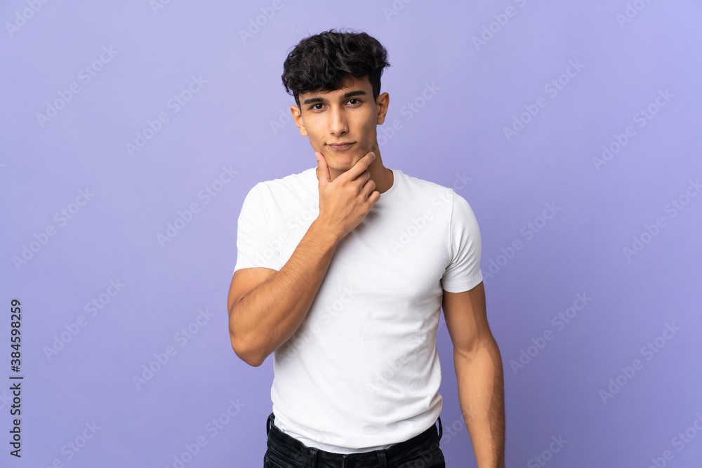 Young Argentinian man isolated on background thinking Young Argentinian man isolated on background thinking