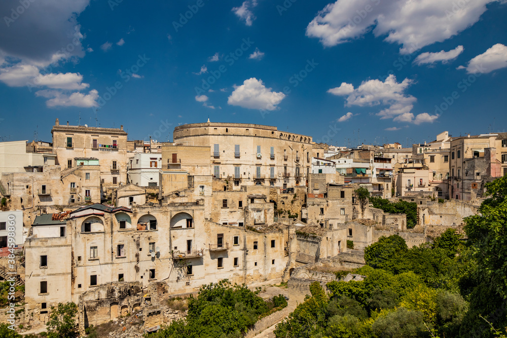 Gravina in Puglia, Italy. The skyline of the city with its ancient houses and buildings. Some broken walls and remains of collapsed and ruined houses.