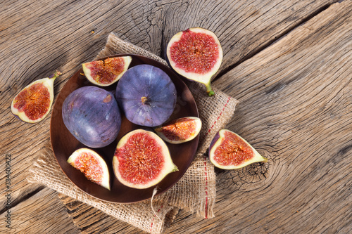 Fig fruits on wooden background top view