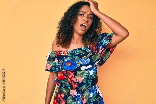 Young african american woman wearing casual clothes surprised with hand on head for mistake  remember error. forgot  bad memory concept.