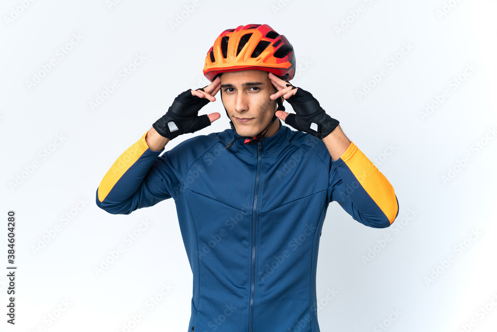 Young cyclist man isolated on background having doubts and thinking Young cyclist man isolated on background having doubts and thinking