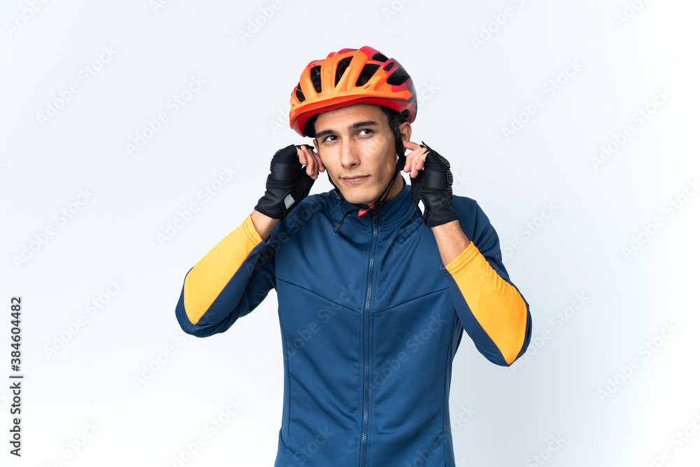 Young cyclist man isolated on background frustrated and covering ears Young cyclist man isolated on background frustrated and covering ears