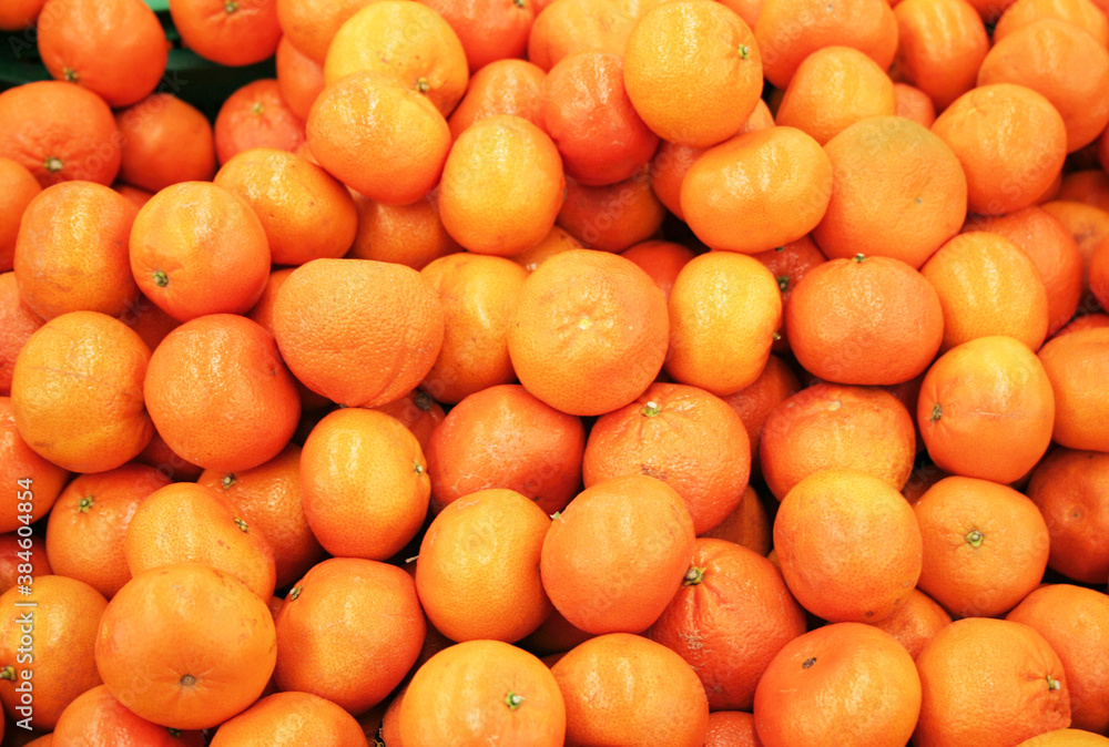 Background from orange tangerines. Proper nutrition, vegetarianism