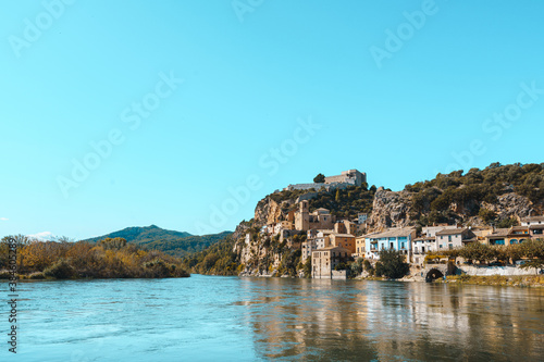 Fototapeta Naklejka Na Ścianę i Meble -  the Ebro River and the old town of Miravet and the Templar castle, Tarragona province in Spain.