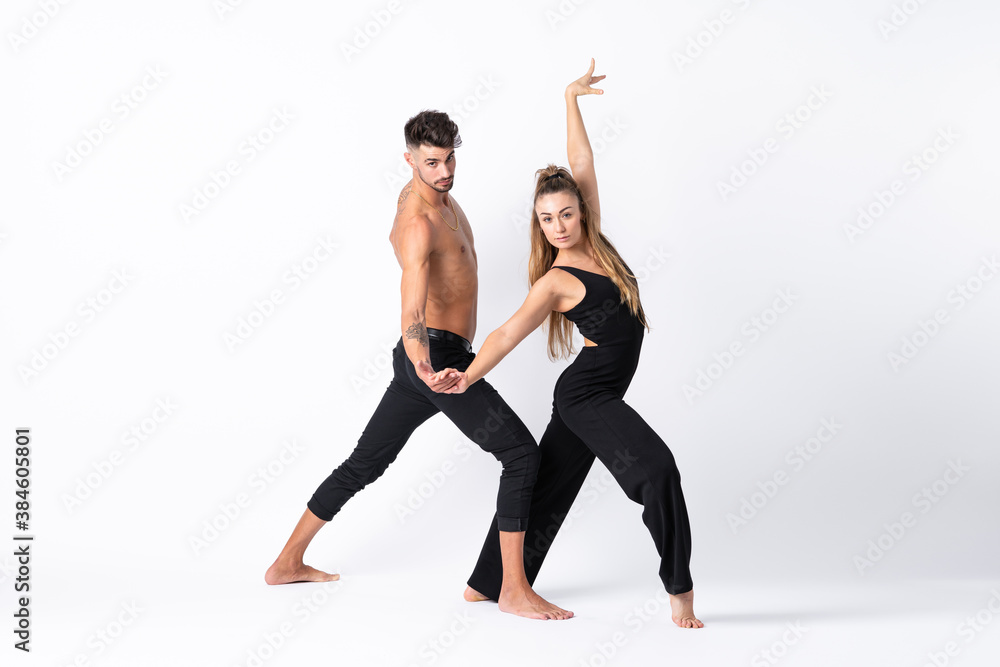 Couple dancing over isolated white background Couple dancing over isolated white background
