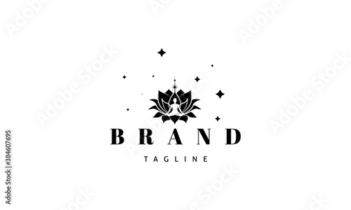 Vector logo in which an abstract image of a lotus flower with a meditating person on a background of stars.