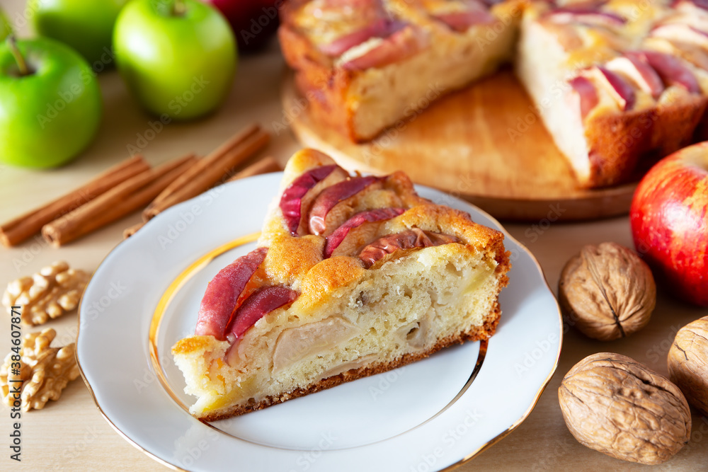 Piece of a tasty apple pie on a white plate, autumn baking concept. Piece of a tasty apple pie on a white plate, autumn baking concept.