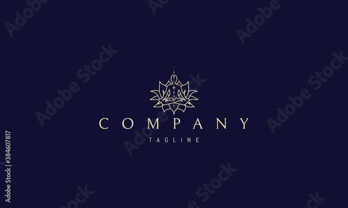 Vector golden logo in which an abstract image of a lotus flower with a meditating person in a linear style.