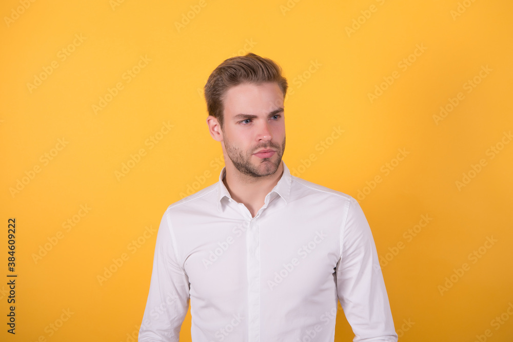handsome confident young man standing in a white shirt. well groomed businessman. male barbershop and hairdresser. beauty and fashion. trendy good looking guy with bristle hair on face handsome confident young man standing in a white shirt. well groomed businessman. male barbershop and hairdresser. beauty and fashion. trendy good looking guy with bristle hair on face